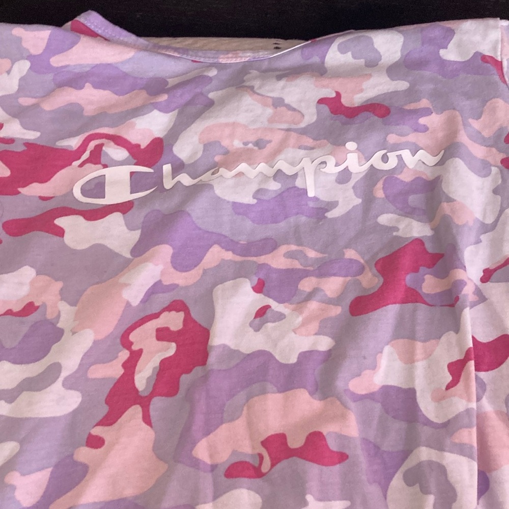 Champions shirt that is purple blue and pink